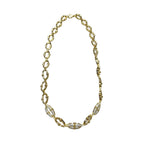 Collier Secure à maillons dorés à l'or fin 24 carats sur fond blanc